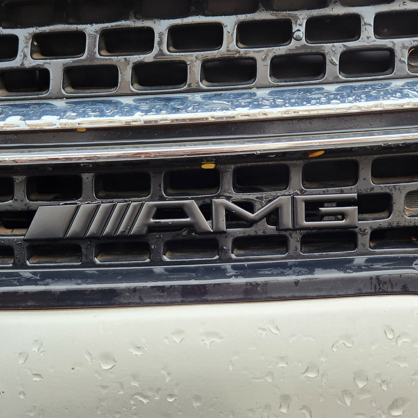 AMG Black Grille Metal Emblem (15.5 x 1.5 cm)